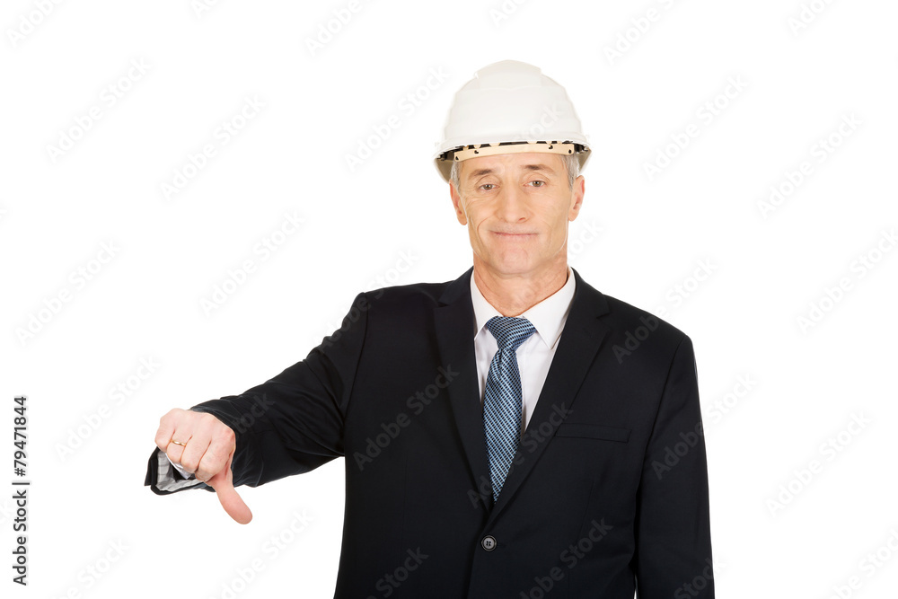 Construction businessman showing thumbs down Construction businessman showing thumbs down