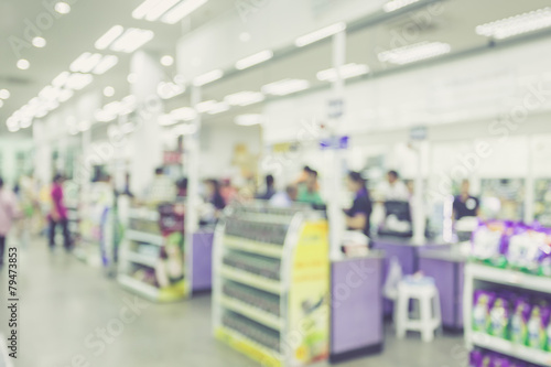 Supermarket store blur background ,Cashier counter with customer