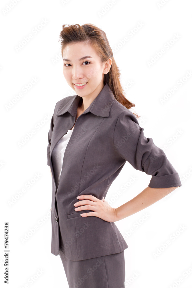 confident business executive looking at camera, arms akimbo confident business executive looking at camera, arms akimbo