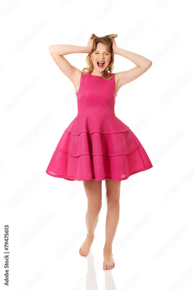 Young angry woman with pink skirt