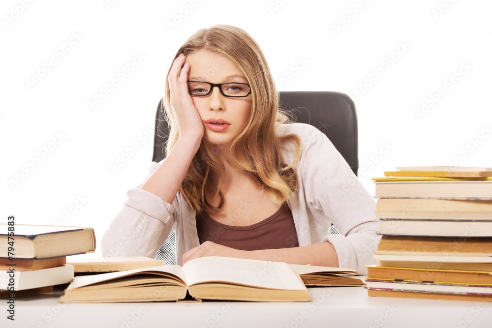 Young woman with a books pile Young woman with a books pile