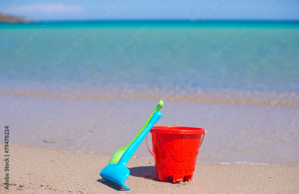 Summer kid's beach toys in the white sandy beach Summer kid's beach toys in the white sandy beach