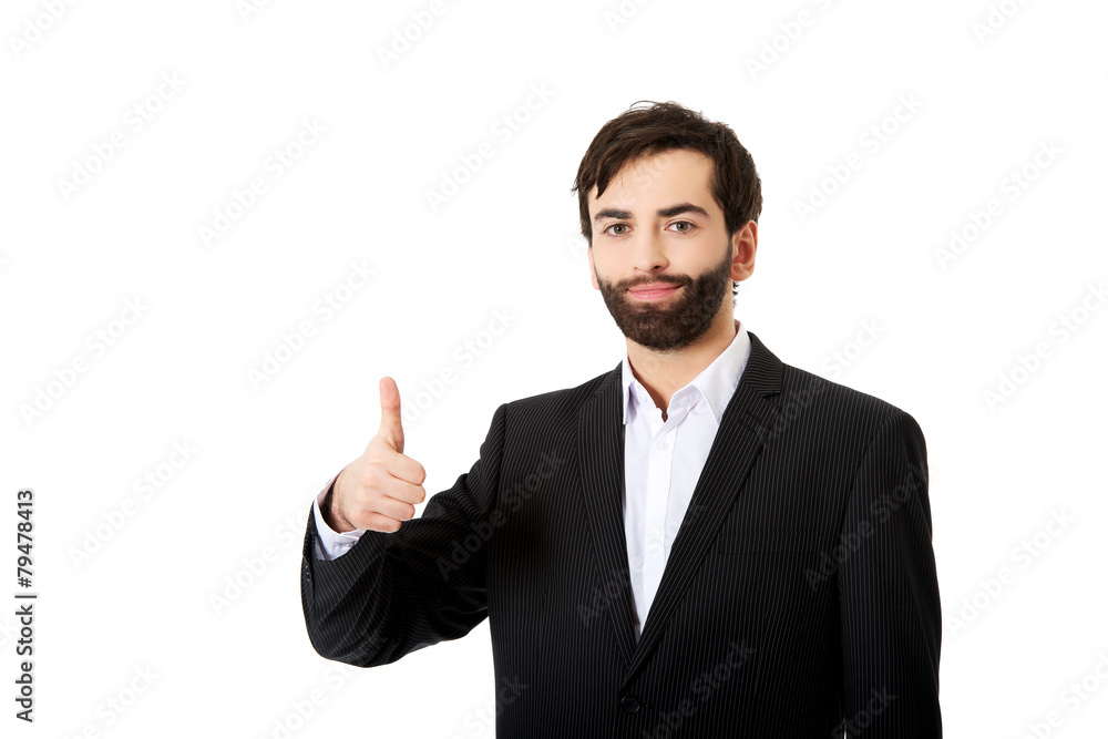 Happy businessman with thumbs up gesture. Happy businessman with thumbs up gesture.