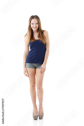 attractive happy teen girl full length portrait isolated on whit © Khorzhevska