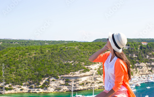 Young happy woman outdoors with beautiful view in Bonifacio city