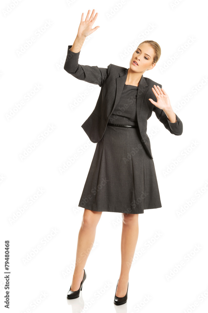 Woman pressing an abstract screen Woman pressing an abstract screen