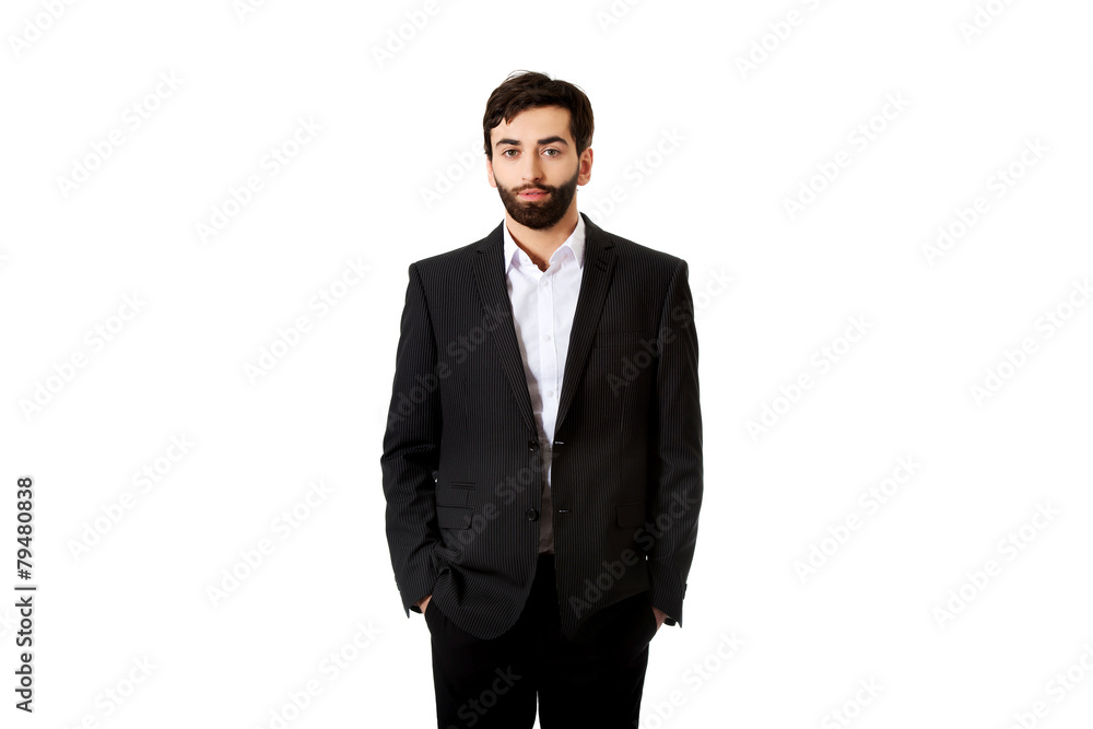 Young handsome businessman standing. Young handsome businessman standing.