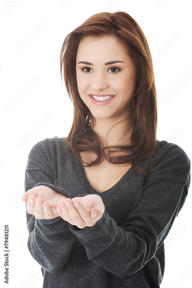 Woman holding something imaginary on hands Woman holding something imaginary on hands