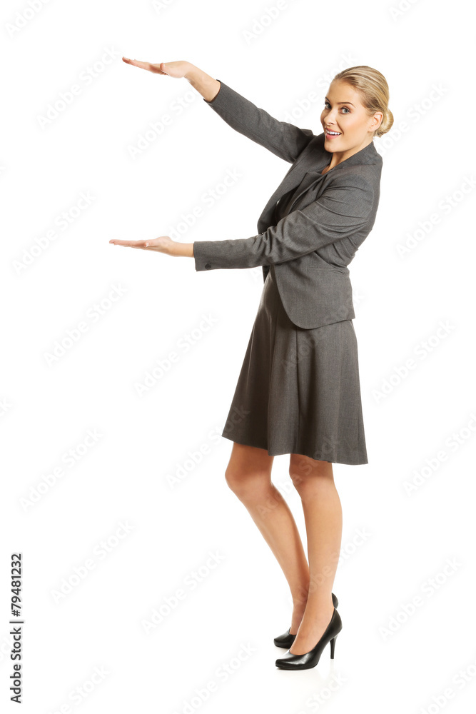 Business woman presenting a copyspace