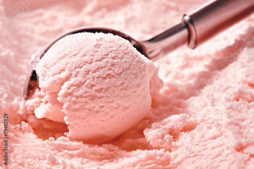 Wallpaper Mural Strawberry ice cream scooped out of container