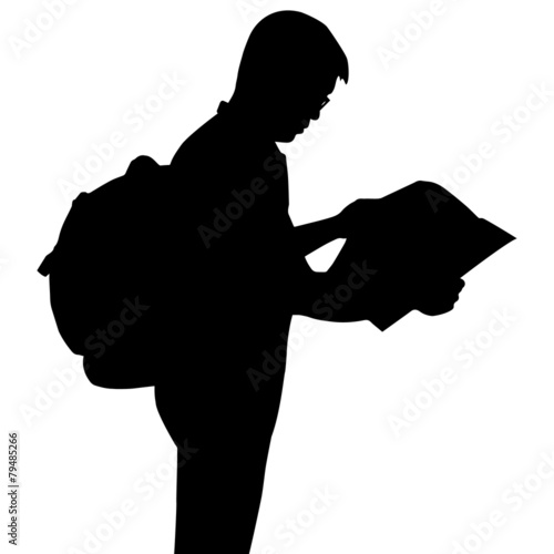 Silhouette backpacker reading map