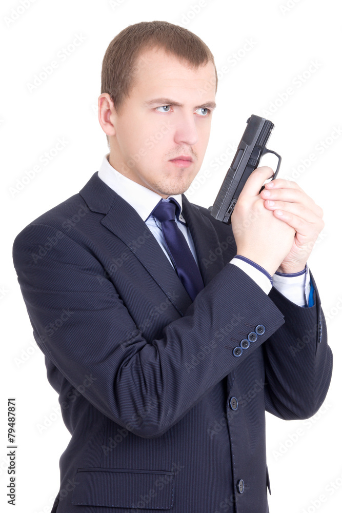 young serious man in business suit with gun isolated on white young serious man in business suit with gun isolated on white