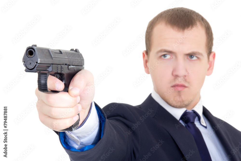 serious man in business suit shooting with handgun isolated on w serious man in business suit shooting with handgun isolated on w