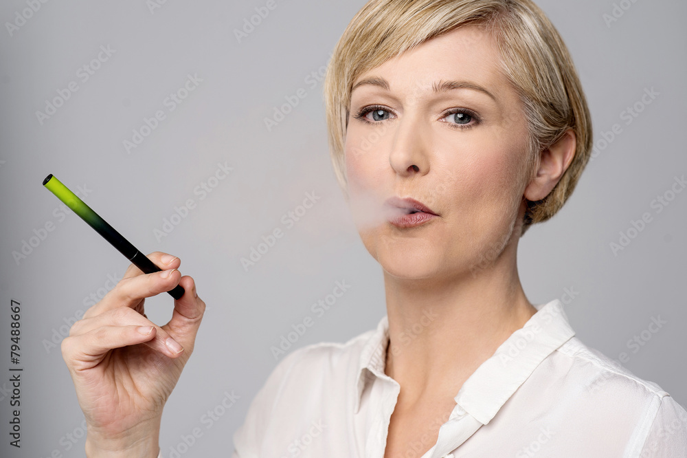 Woman with e-cigarette. Woman with e-cigarette.