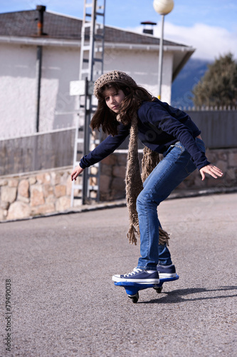 Girl playing with a wave board. Skateboard