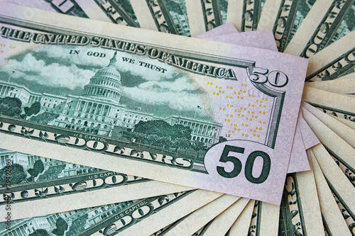 Dollar notes, folded like a fan.