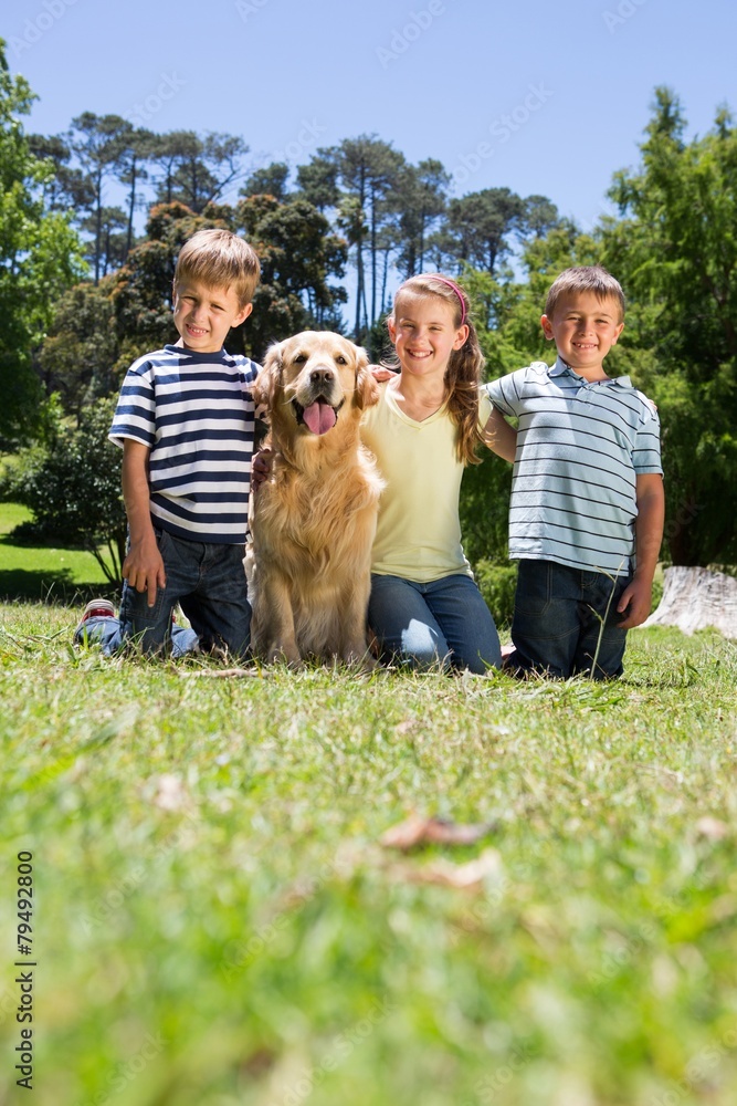 Obraz premium Happy siblings with their dog