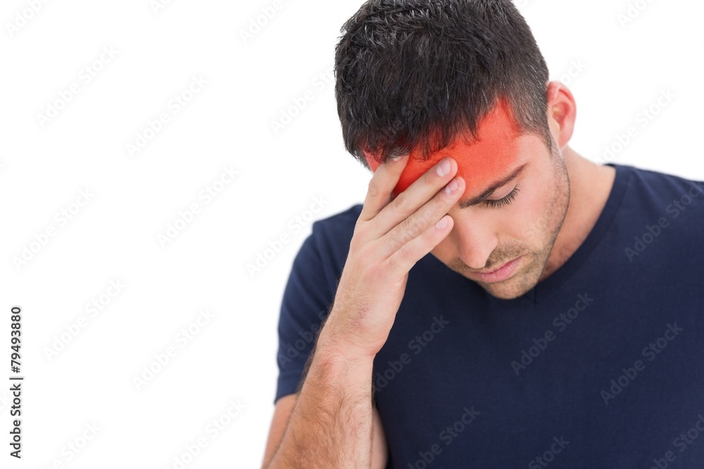 Upset man standing with his hand holding his forehead Upset man standing with his hand holding his forehead