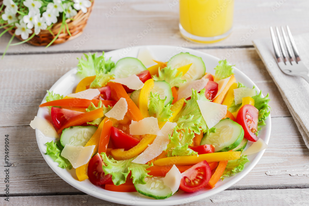 vegetable salad with tomato cucumber pepper and parmesan cheese