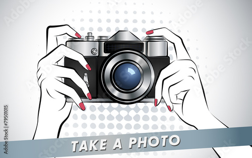 Hands holding camera