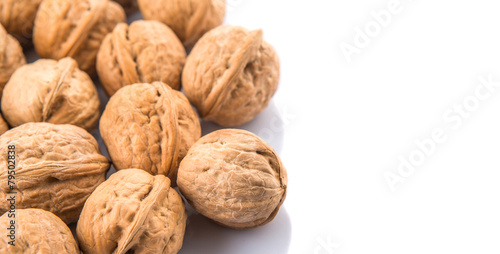Walnut nuts over white background