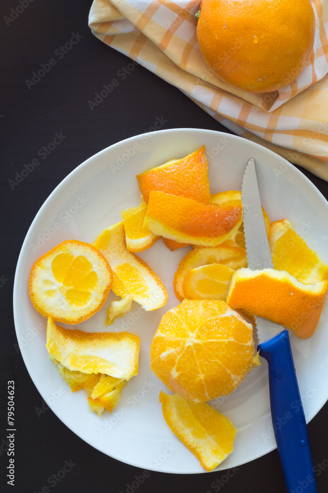 Orange Peeled with Knife for Cutting into Segments Orange Peeled with Knife for Cutting into Segments