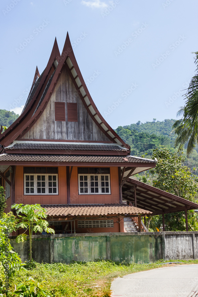 Little Thai houses and palm trees