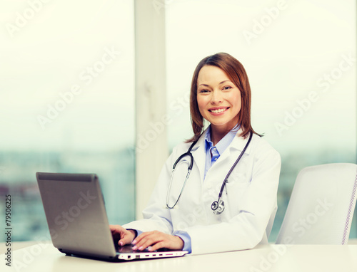 busy doctor with laptop computer