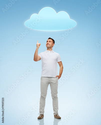 smiling man pointing finger up to cloud © Syda Productions