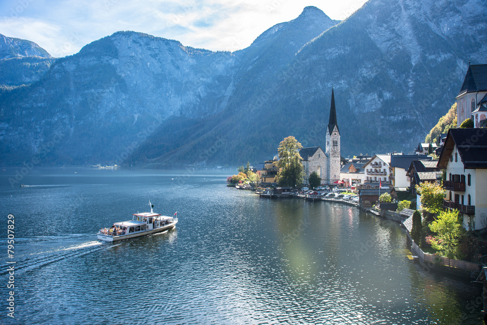 View of famous old town Hallstatt village in Alps at sunny day, Salzkammergut, Austria