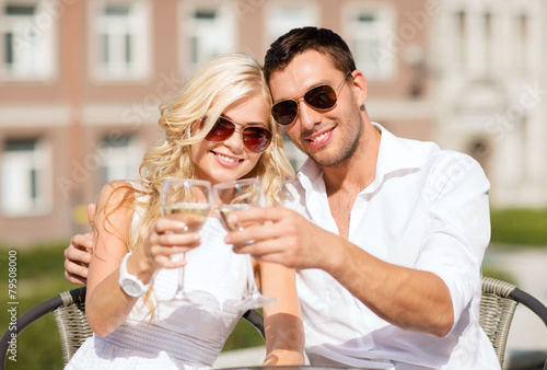 couple drinking wine in cafe