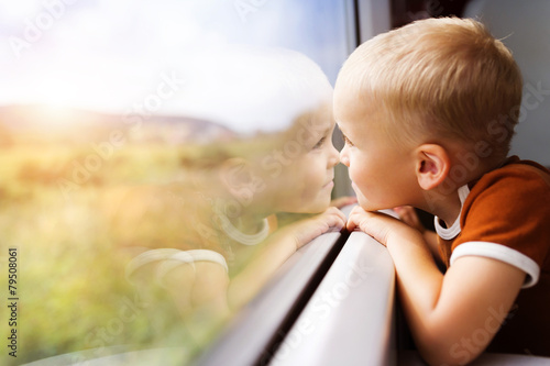 Little boy travelling in train