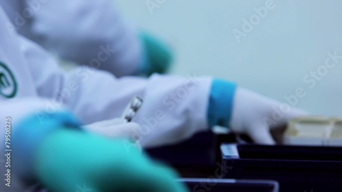 Manual packing of medicine at a pharmaceutical factory