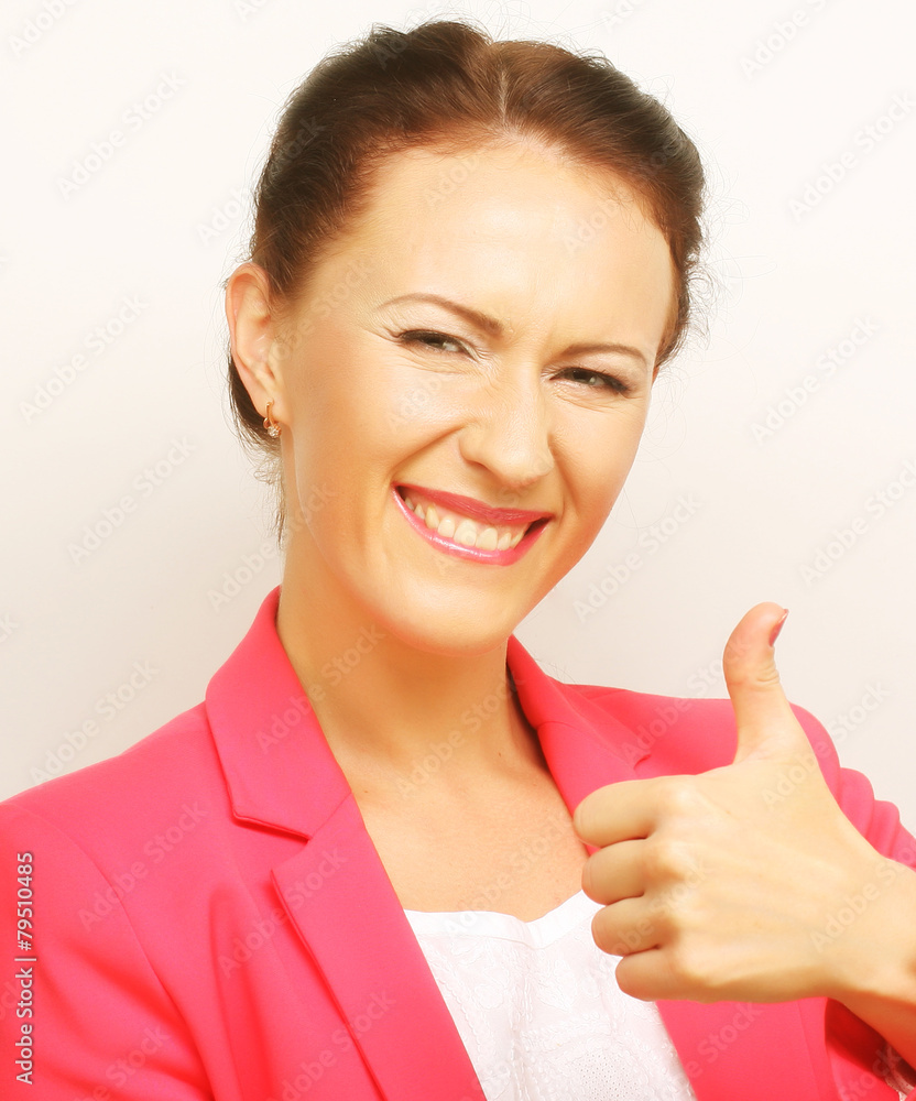 Successful businesswoman gives thumb up Successful businesswoman gives thumb up