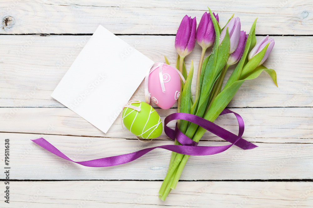 Fototapeta premium Purple tulip bouquet, easter eggs and blank greeting card