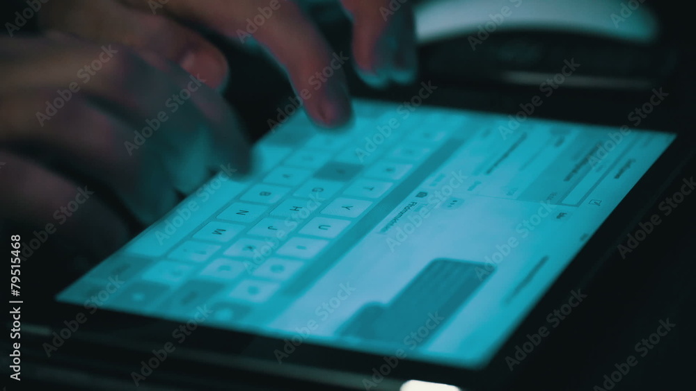 Male Hands Typing on a Tablet Computer, closeup Male Hands Typing on a Tablet Computer, closeup