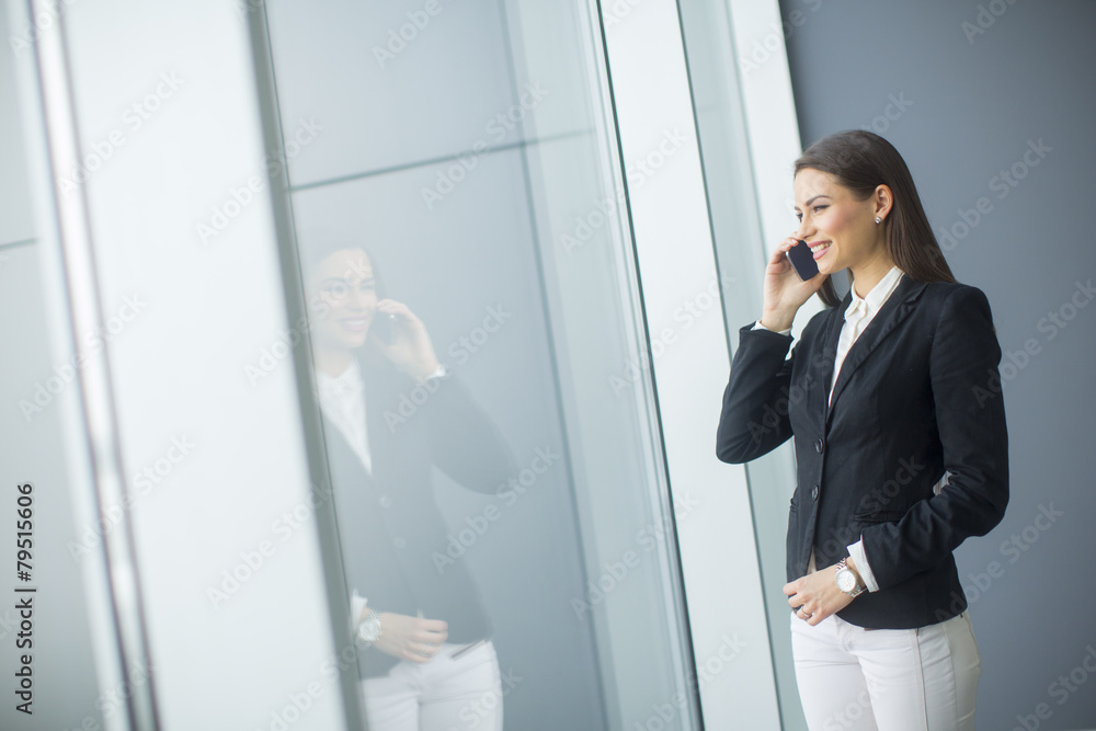 Young woman talking on the phone Young woman talking on the phone