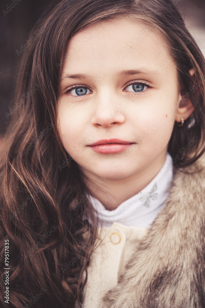 close up outdoor portrait of beautiful smiling child girl
