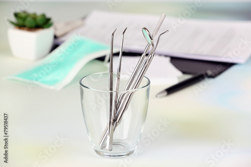 Dentist tools in glass table close up