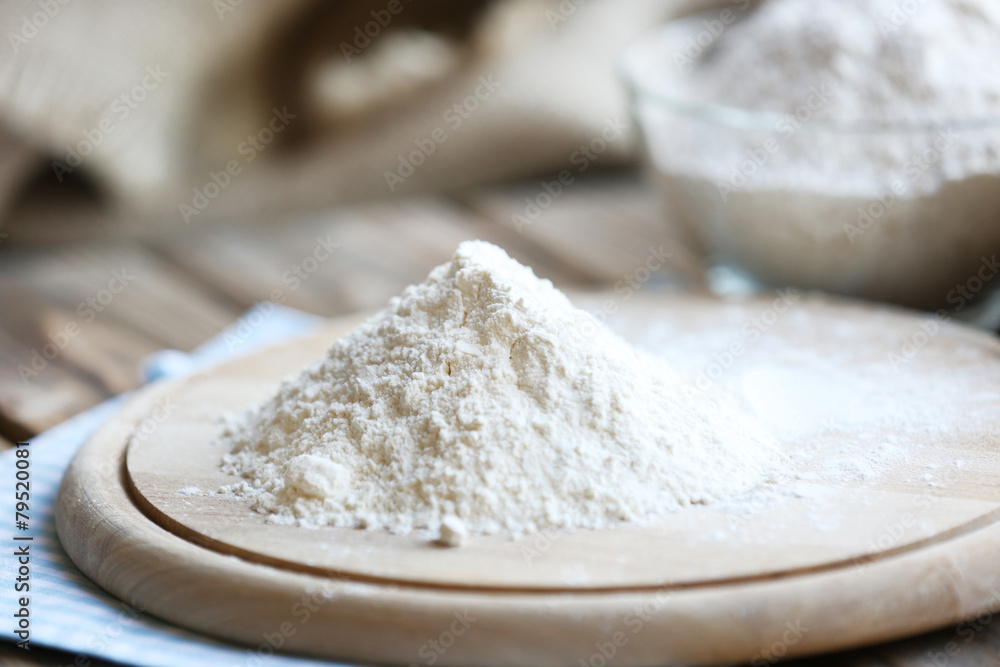 Pile of flour on cutting board, closeup Pile of flour on cutting board, closeup