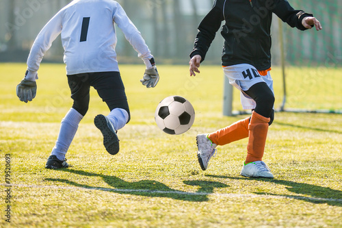 Fototapeta Naklejka Na Ścianę i Meble -  Football soccer match for children. Boys playing football