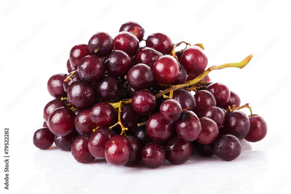 Fresh red grapes and water drops isolated on white background