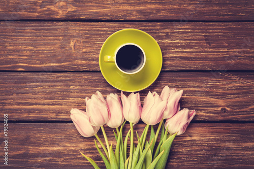 Fototapeta Naklejka Na Ścianę i Meble -  Cup of coffee and bouquet of tulips