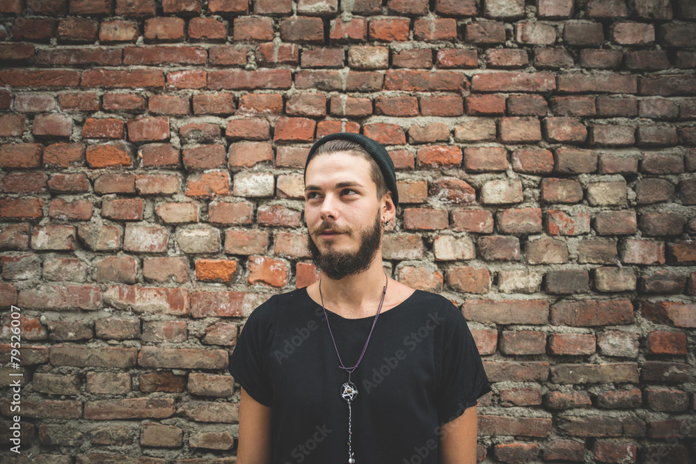 Obraz premium young handsome bearded hipster man