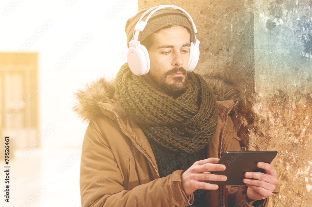 stylish hipster man using table with a warm tone filter applied stylish hipster man using table with a warm tone filter applied