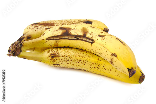 Overripe and rotten bananas on white background