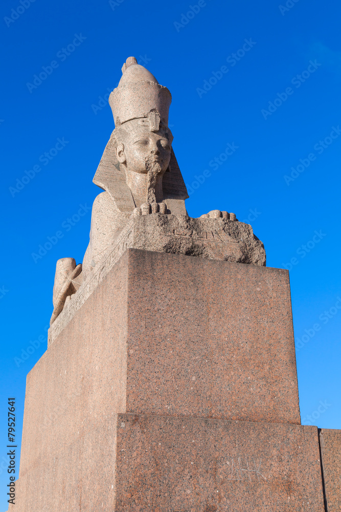 Granite sphinx ancient monument on blue sky