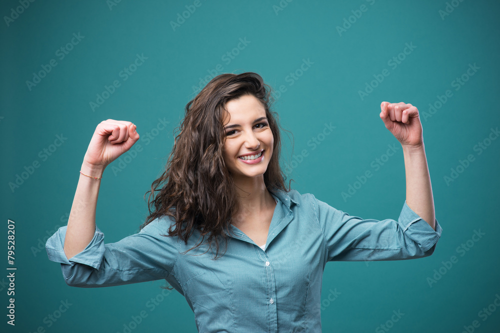 Cheerful woman with raised fists Cheerful woman with raised fists