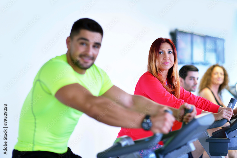 Group of people running on treadmills Group of people running on treadmills