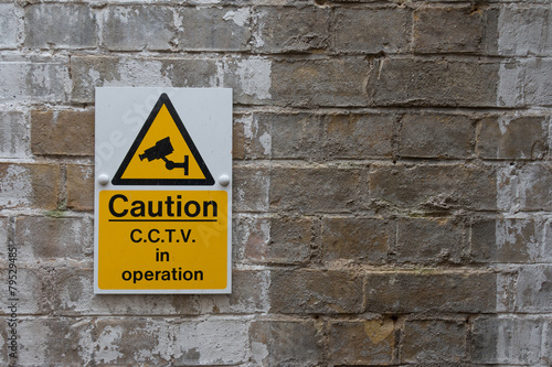 CCTV Caution Sign on Vintage Brick Wall